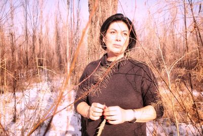 Portrait of woman standing on land