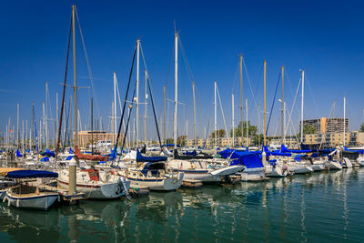 Boats moored at harbor