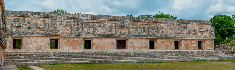 View of old building against cloudy sky