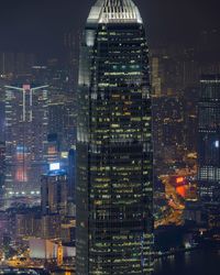 Illuminated cityscape against sky at night