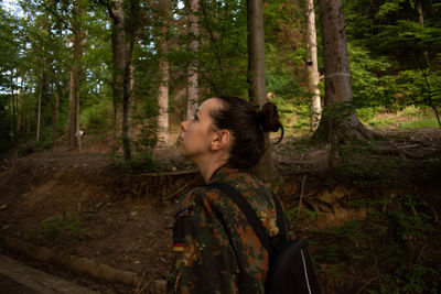 Side view of senior man in forest