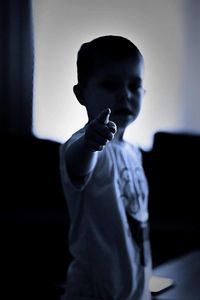 Portrait of man standing on mobile phone