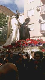 People in front of flowers