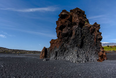 Lava rock ramparts on the black beach of djupalon on the snaefellsnes peninsula in iceland