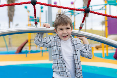 Portrait of boy playing in playground