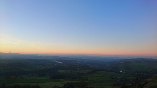 Scenic view of landscape against sky during sunset