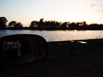 Reflection of sky in side-view mirror