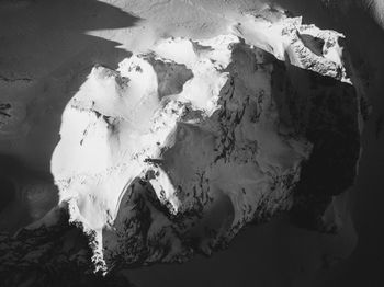 High angle view of snow on rock