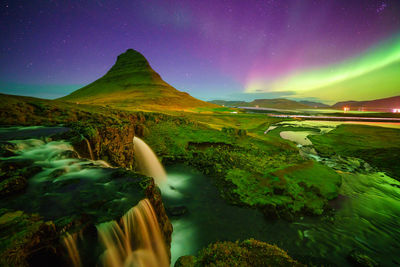 Scenic view of mountains against sky at night