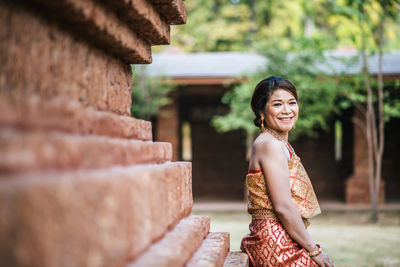 Portrait of woman standing outdoors