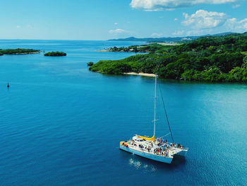 Sailboat on sea against sky