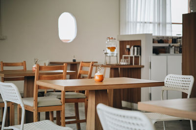 Empty chairs and table in restaurant