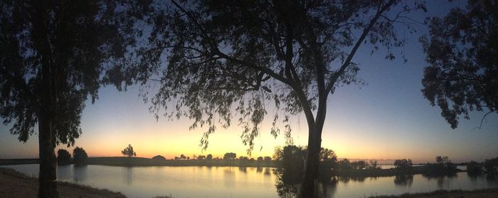 Scenic view of lake at sunset