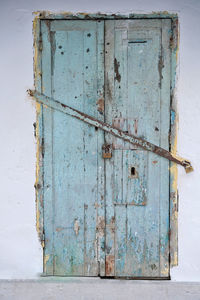 Closed door of abandoned house