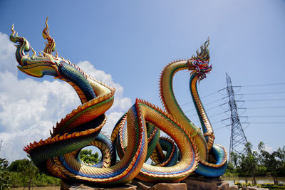 Low angle view of statue against sky