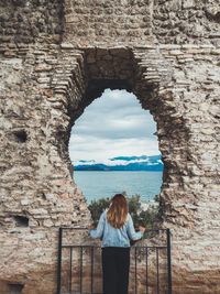 Rear view of woman looking at sea