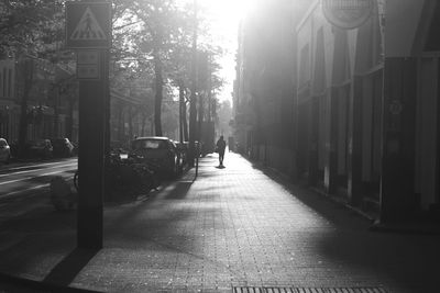 People walking on road in city