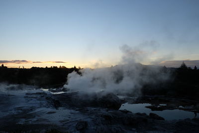 Hot spring at maori against sky during sunset