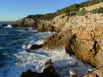 High angle view of rocks by sea