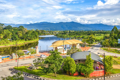 High angle view of trees by lake against sky