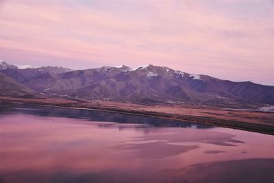 Scenic view of lake against romantic sky at sunset