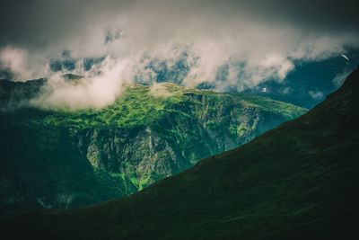 Scenic view of waterfall against sky