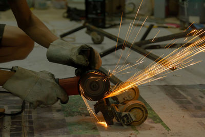 Low angle view of person working at factory