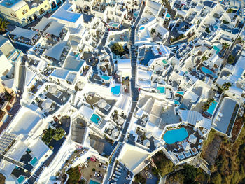 High angle view of crowd by buildings in city