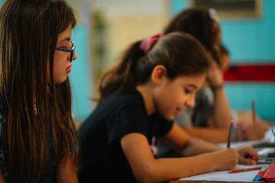 Portrait of schoolmates in classroom