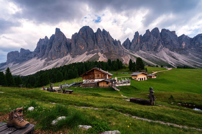 Scenic view of field and mountains against sky