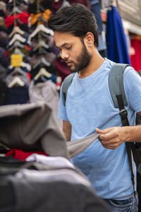 Full length of man standing at store