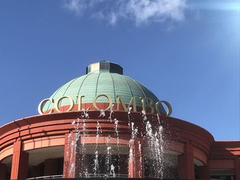 Low angle view of building against blue sky