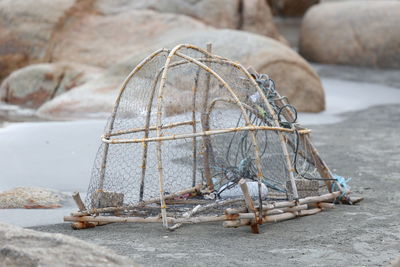 Close-up of fishing net on rock