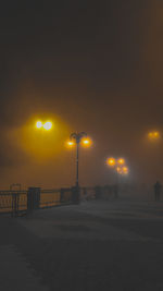 Street lights against sky at night