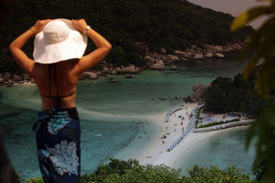 Rear view of woman looking at beach