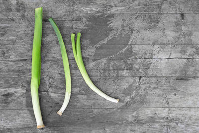 Close-up high angle view of leek on wooden table