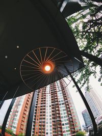 Low angle view of illuminated buildings against sky