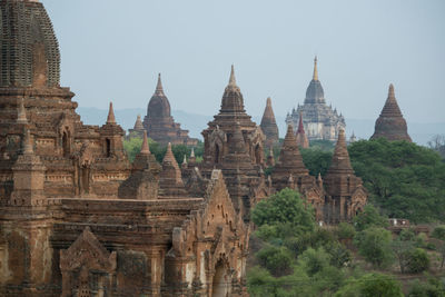 Old ruins of temples against clear sky