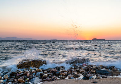 Scenic view of sea against sky during sunset