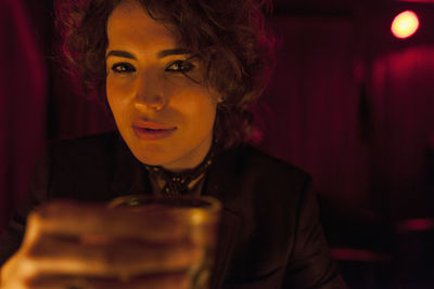 Woman enjoying a drink at a bar