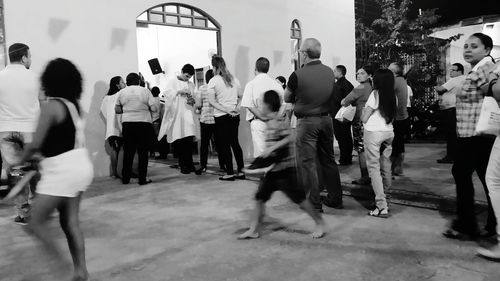 People walking on street in city