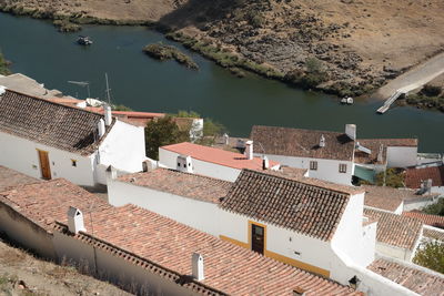 High angle view of townscape by lake