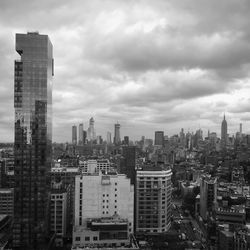 Modern buildings in city against sky