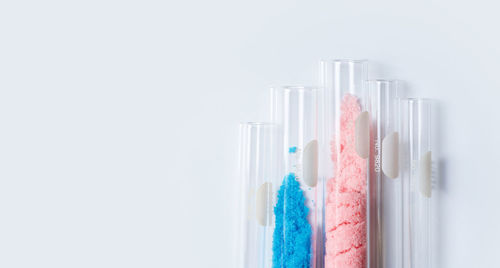 Close-up of pen on table against white background