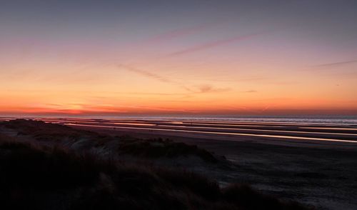Scenic view of sea at sunset
