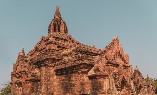 Low angle view of temple against building