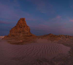 Scenic view of desert against sky during sunset