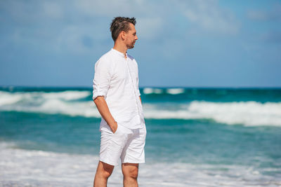 Full length of man standing at beach