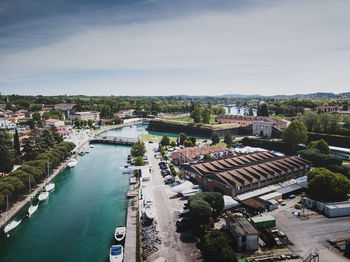 High angle view of river amidst buildings in city