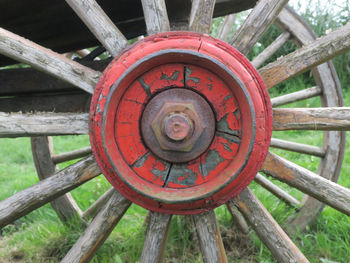 Close-up of red wheel on field
